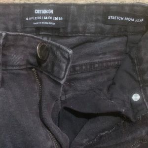 size 2 black jeans with rips in knees from cotton on